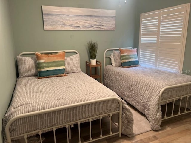 bedroom featuring wood finished floors