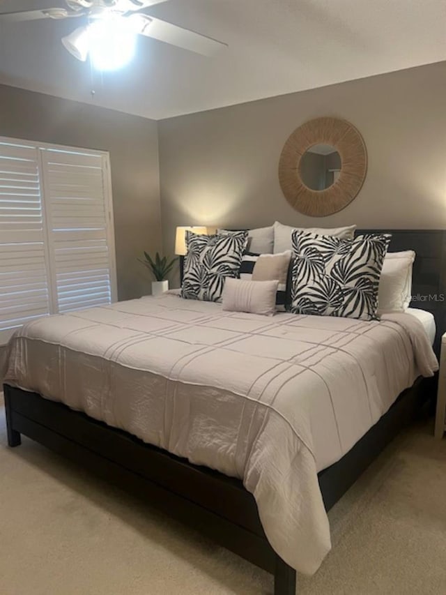 bedroom with carpet floors and a ceiling fan