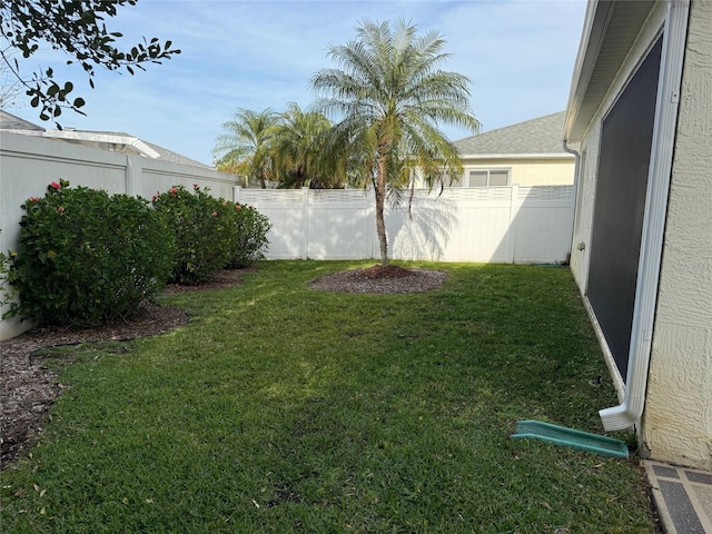 view of yard with a fenced backyard