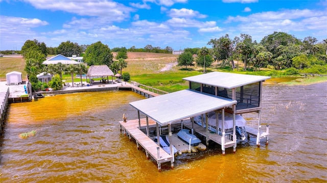 dock area with a water view and boat lift