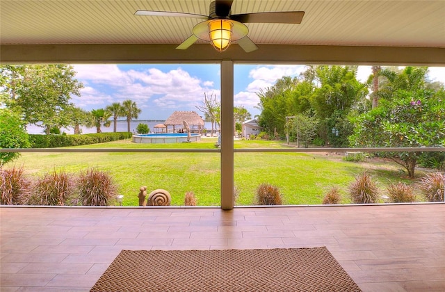 view of patio featuring a swimming pool and ceiling fan