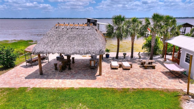 surrounding community with a water view, a gazebo, and a patio