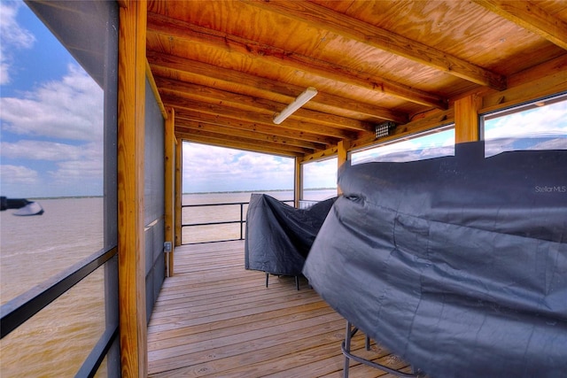 wooden deck featuring a water view