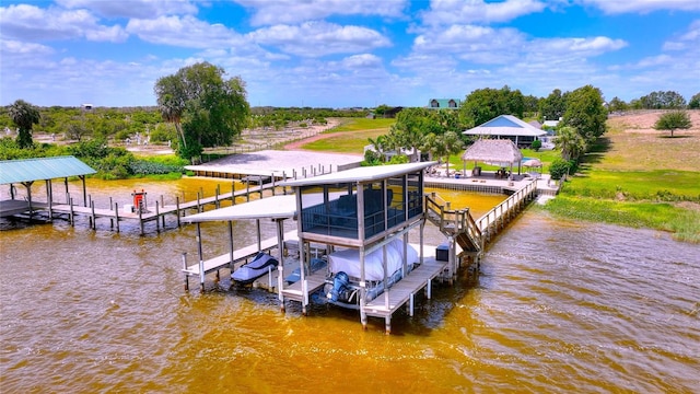 view of dock featuring a water view, boat lift, and a gazebo