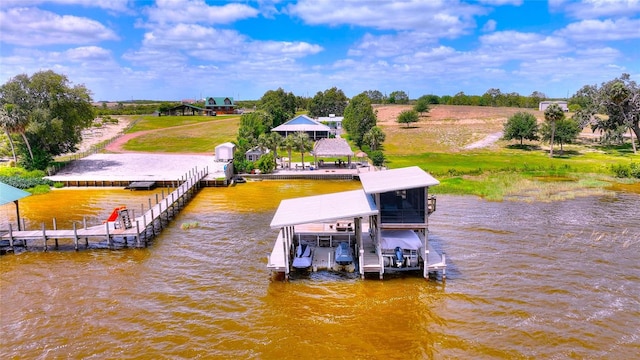 dock area with a water view and boat lift