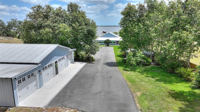 1395 S Lake Reedy Blvd, Frostproof, FL 33843 - view of asphalt driveway with a water view
