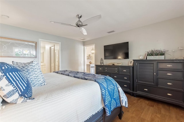 1395 S Lake Reedy Blvd, Frostproof, FL 33843 - bedroom featuring dark wood-type flooring, a ceiling fan, and ensuite bathroom