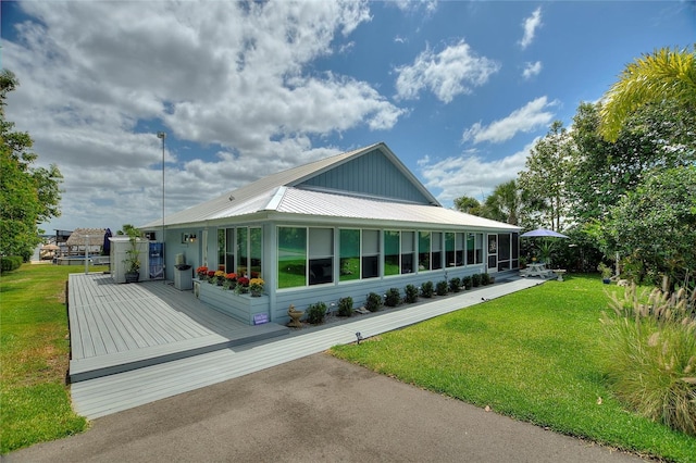 1395 S Lake Reedy Blvd, Frostproof, FL 33843 - view of home's exterior with metal roof and a yard