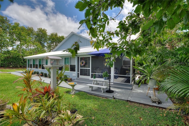 1395 S Lake Reedy Blvd, Frostproof, FL 33843 - back of house featuring a deck and a lawn