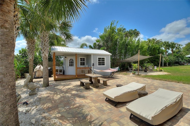 1395 S Lake Reedy Blvd, Frostproof, FL 33843 - view of patio featuring a deck and an outbuilding