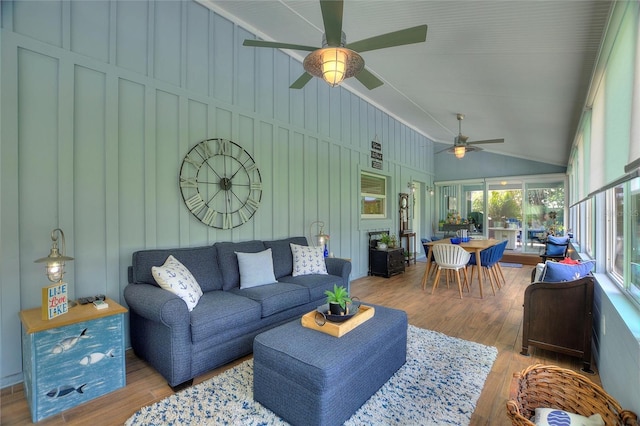 1395 S Lake Reedy Blvd, Frostproof, FL 33843 - living room with a ceiling fan, lofted ceiling, wood finished floors, and a decorative wall