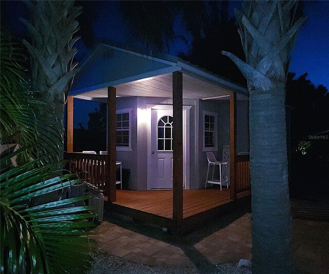 1395 S Lake Reedy Blvd, Frostproof, FL 33843 - exterior entry at twilight featuring a deck