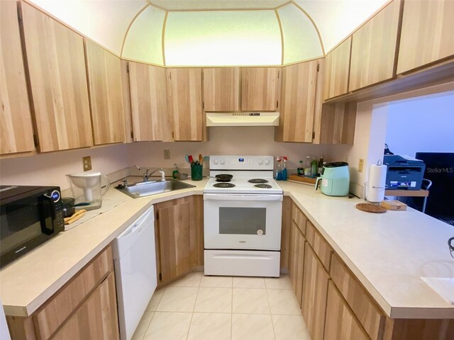 2643 Pine Ridge Way S Unit A1, Palm Harbor, FL 34684 - kitchen with white appliances, under cabinet range hood, light countertops, and a sink
