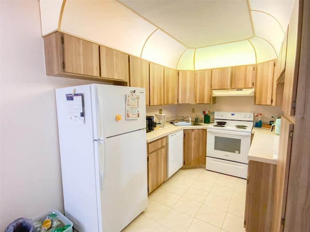 2643 Pine Ridge Way S Unit A1, Palm Harbor, FL 34684 - kitchen featuring a sink, under cabinet range hood, white appliances, light brown cabinetry, and light countertops