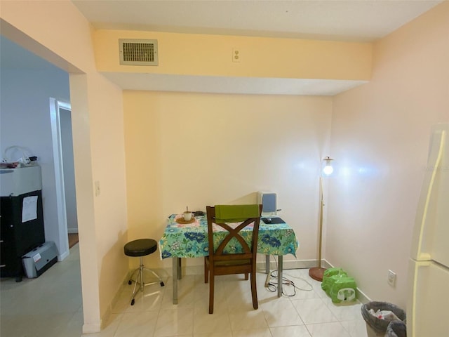 2643 Pine Ridge Way S Unit A1, Palm Harbor, FL 34684 - dining space with visible vents and baseboards