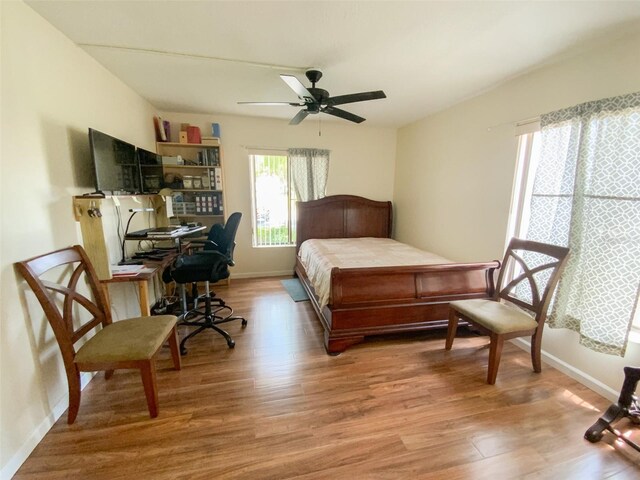 2643 Pine Ridge Way S Unit A1, Palm Harbor, FL 34684 - bedroom featuring baseboards and light wood-style floors