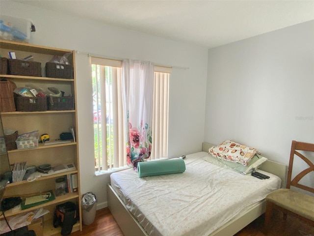 2643 Pine Ridge Way S Unit A1, Palm Harbor, FL 34684 - bedroom with wood finished floors and multiple windows