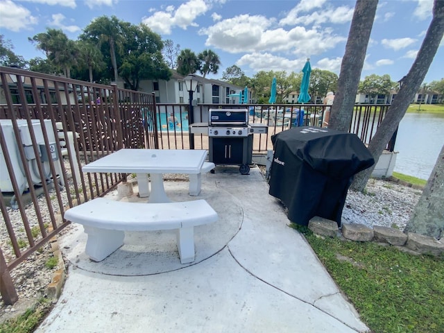 2643 Pine Ridge Way S Unit A1, Palm Harbor, FL 34684 - view of patio / terrace with a grill and fence