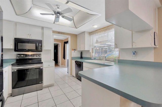kitchen featuring a sink, a ceiling fan, light tile patterned floors, tasteful backsplash, and black appliances
