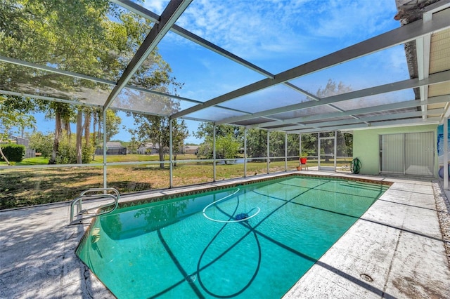 outdoor pool with a lanai and a patio