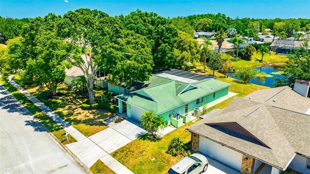 bird's eye view with a water view and a residential view