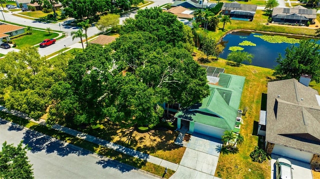 birds eye view of property featuring a water view and a residential view