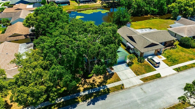 drone / aerial view with a water view and a residential view