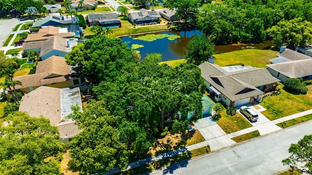 bird's eye view featuring a water view and a residential view