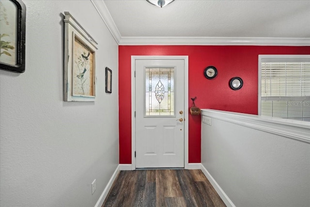doorway featuring ornamental molding, dark wood-style floors, and baseboards
