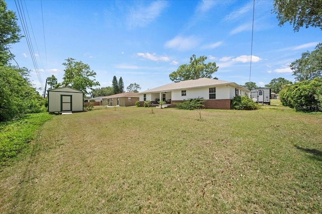 view of yard with a shed and an outbuilding
