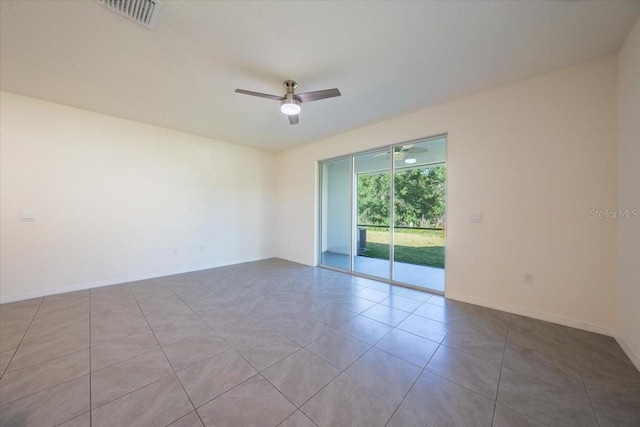 unfurnished room with baseboards, tile patterned flooring, a ceiling fan, and visible vents