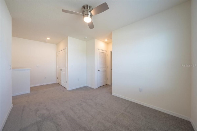 unfurnished room featuring baseboards, carpet flooring, a ceiling fan, and recessed lighting