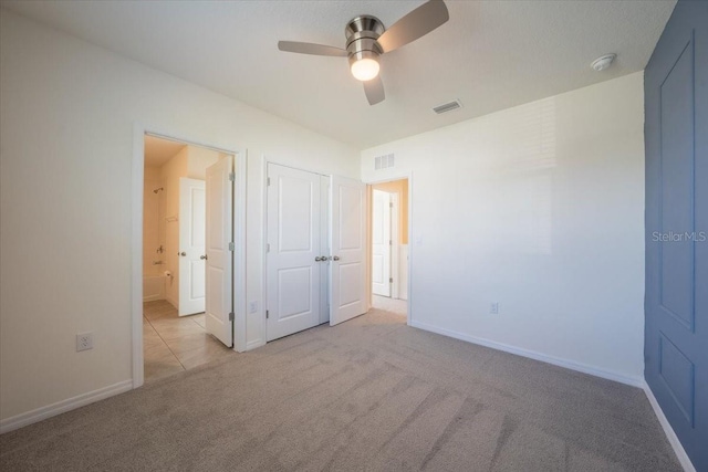 unfurnished bedroom featuring carpet flooring, baseboards, and visible vents