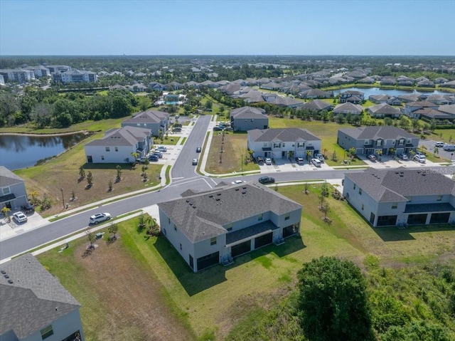bird's eye view featuring a water view and a residential view