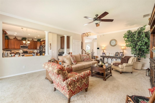 living room featuring visible vents, crown molding, decorative columns, light carpet, and ceiling fan with notable chandelier