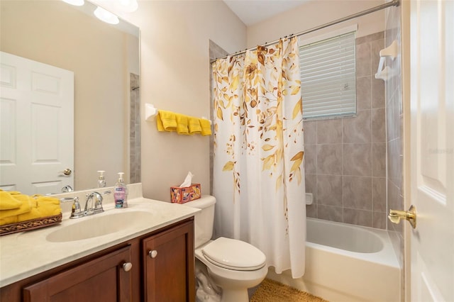 bathroom featuring vanity, shower / bath combo with shower curtain, and toilet