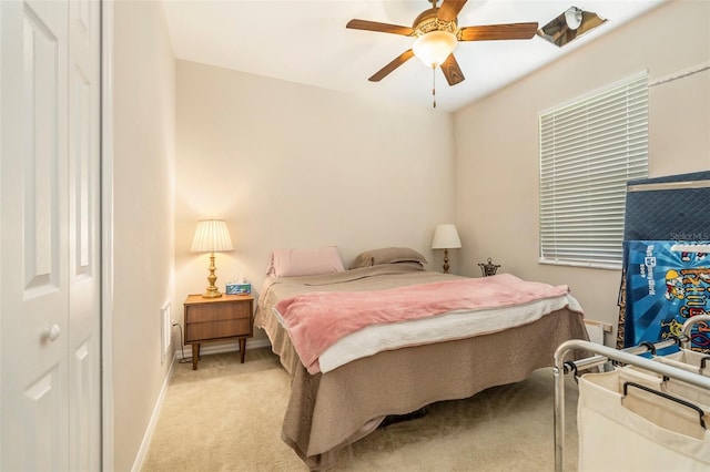 bedroom with baseboards, light carpet, and ceiling fan
