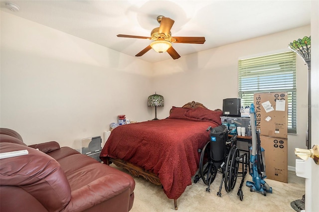 carpeted bedroom with a ceiling fan