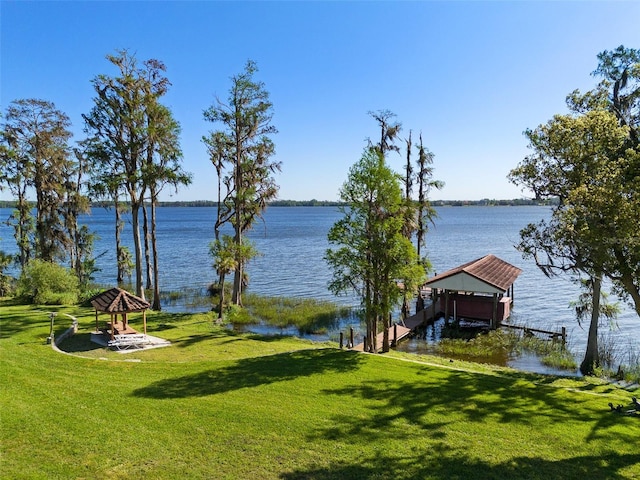 exterior space featuring boat lift, a gazebo, and a boat dock