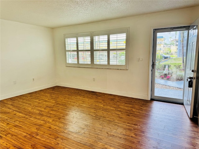 5660 80th St N Unit C101, Saint Petersburg, FL 33709 - empty room with baseboards, plenty of natural light, and wood-type flooring