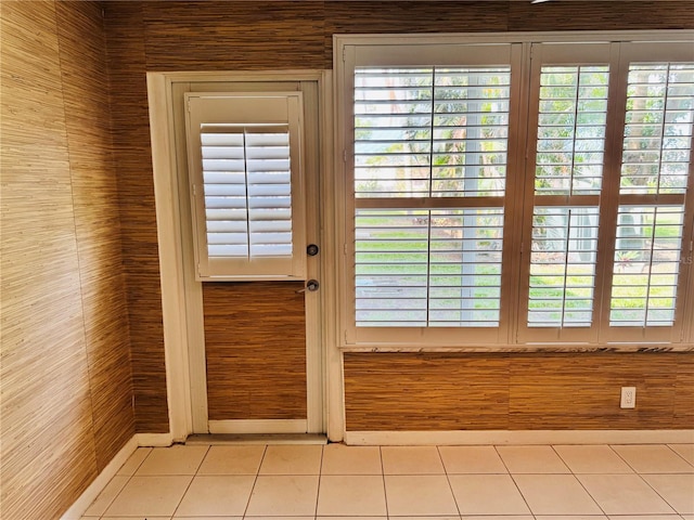 5660 80th St N Unit C101, Saint Petersburg, FL 33709 - doorway to outside with tile patterned floors and a healthy amount of sunlight