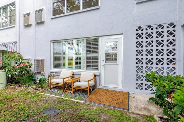 5660 80th St N Unit C101, Saint Petersburg, FL 33709 - view of exterior entry featuring stucco siding