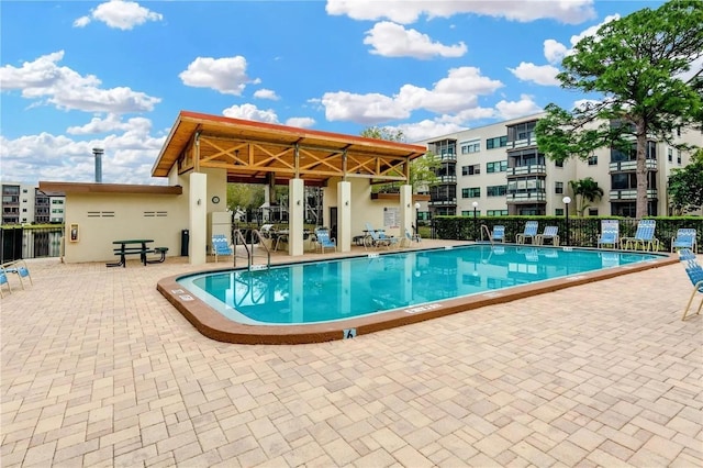 5660 80th St N Unit C101, Saint Petersburg, FL 33709 - community pool with fence and a patio area