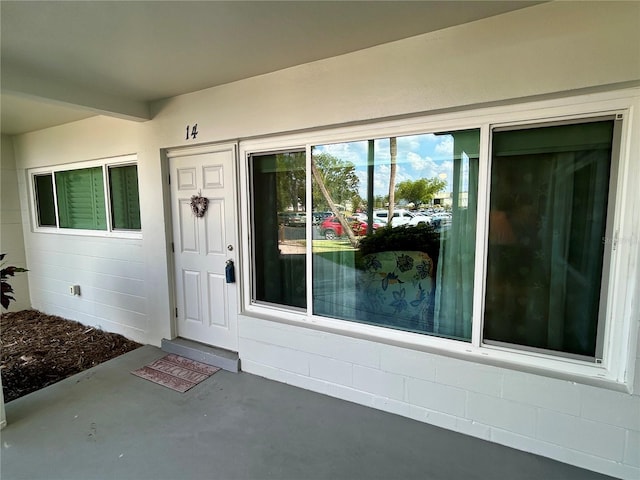 2020 World Parkway Blvd Unit 14, Clearwater, FL 33763 - view of exterior entry featuring concrete block siding