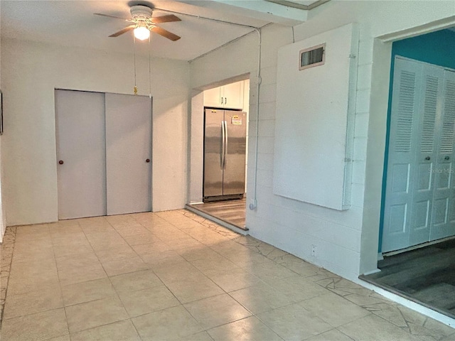 2020 World Parkway Blvd Unit 14, Clearwater, FL 33763 - unfurnished room featuring light tile patterned floors, visible vents, and a ceiling fan