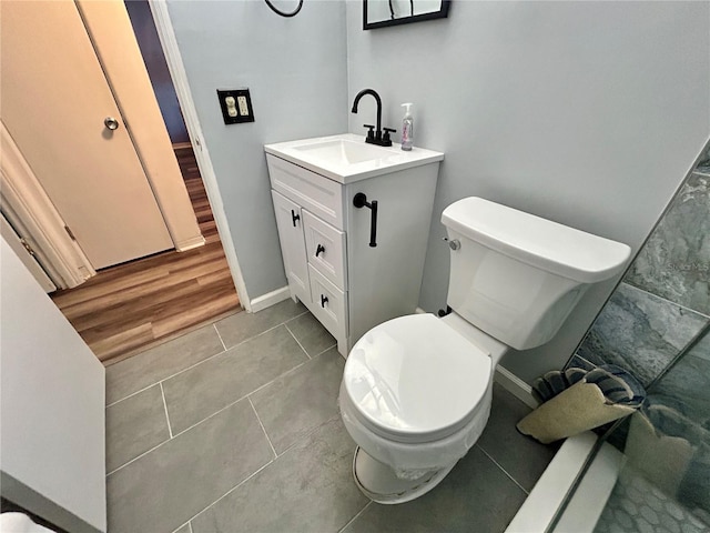 2020 World Parkway Blvd Unit 14, Clearwater, FL 33763 - bathroom with tile patterned floors, vanity, toilet, and baseboards