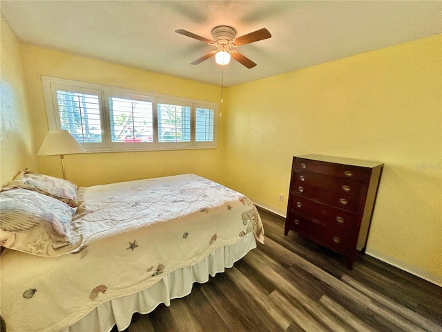 2020 World Parkway Blvd Unit 14, Clearwater, FL 33763 - bedroom with dark wood-style flooring, ceiling fan, and baseboards