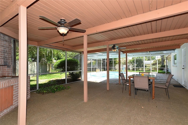 view of patio / terrace featuring ceiling fan, fence, a fenced in pool, glass enclosure, and outdoor dining space