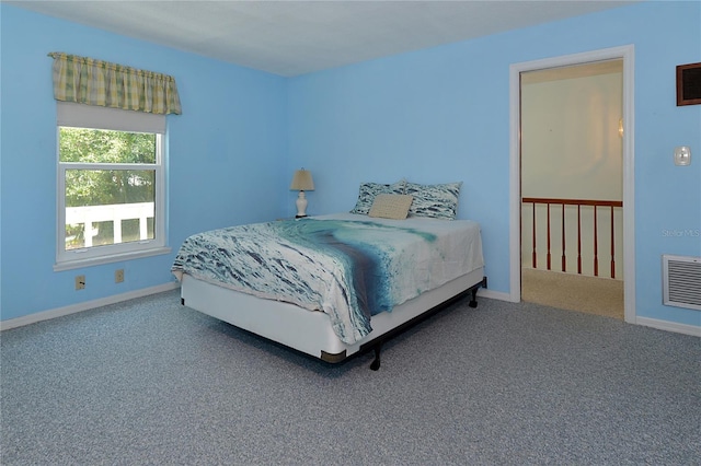 carpeted bedroom with baseboards and visible vents