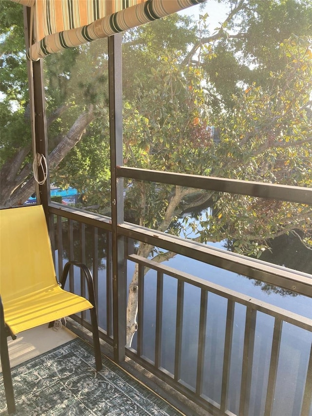 7951 58th Ave N Unit 308, Saint Petersburg, FL 33709 - unfurnished sunroom featuring a water view